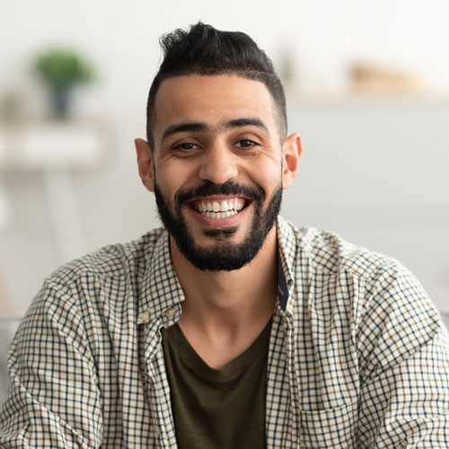 portrait-of-handsome-young-arab-man-smiling-and-l